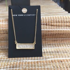 NWT NY&C gold tone bar